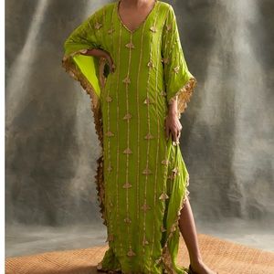 Beautiful floor length green kaftan with embroidered handmade lampi triangles.